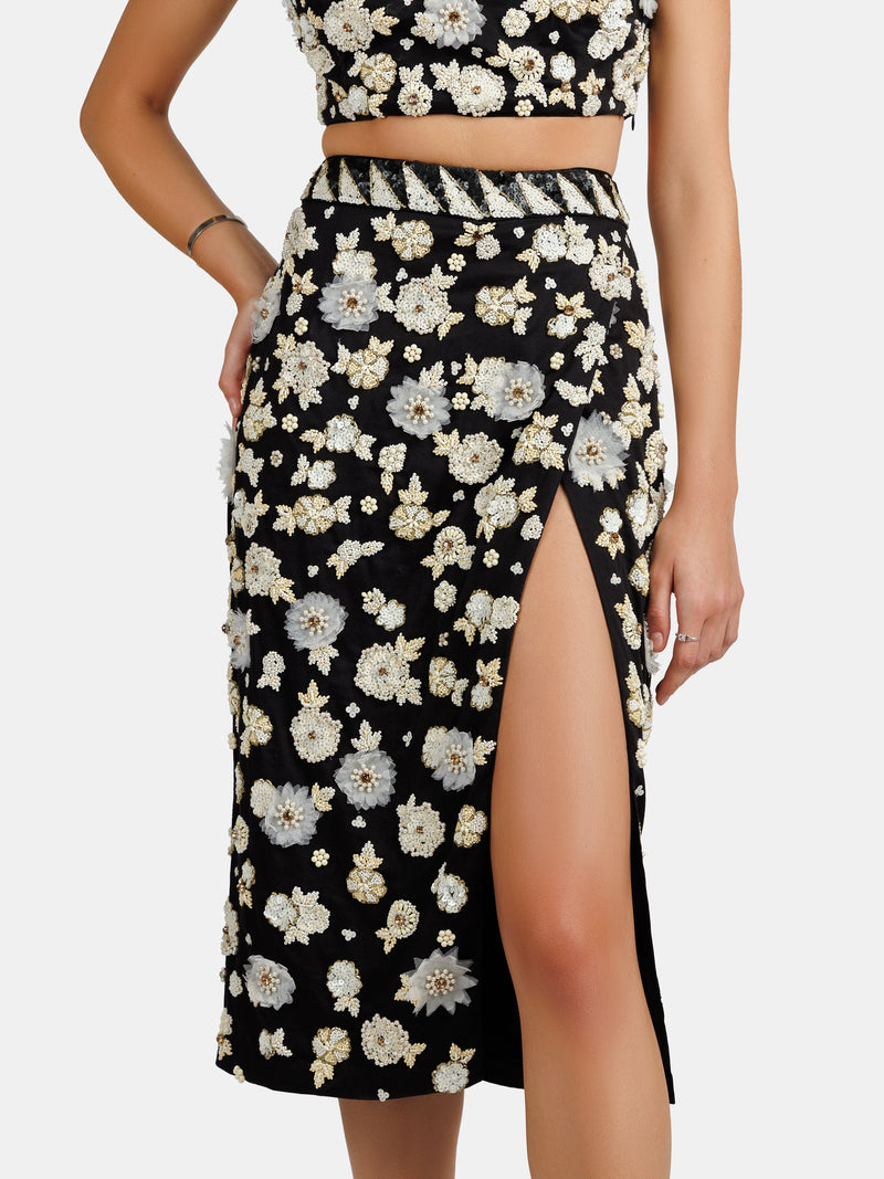 Floral silver sequin-embellished black skirt with an invisible zp and leg opening design by Maryjane Claverol