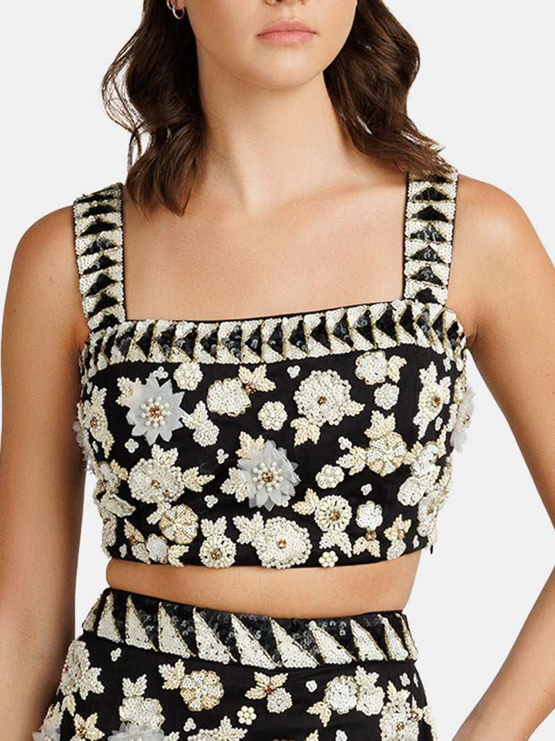 Beaded top in black and white and flower motifs designed by Maryjane Claverol
